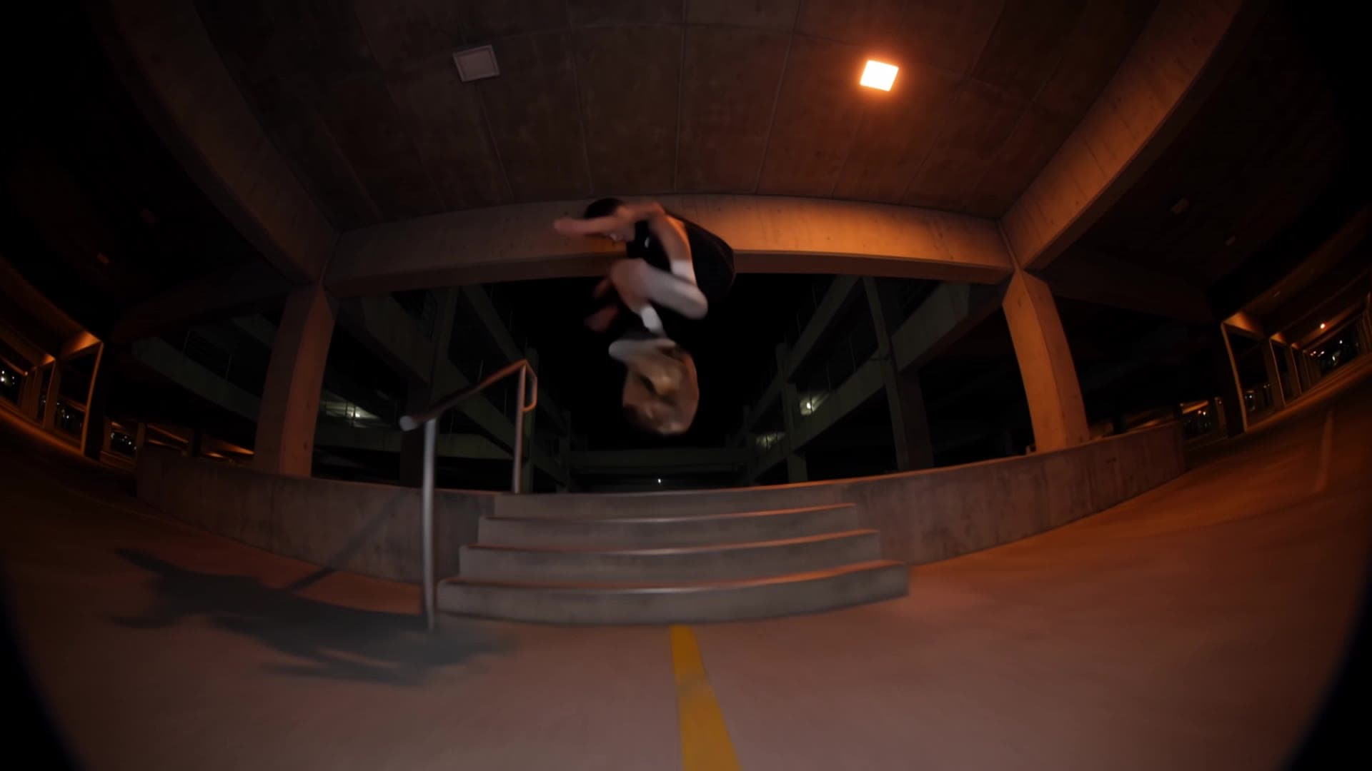 A frame from the Kling 4 skateboarding clip, mid-kickflip over the stairs