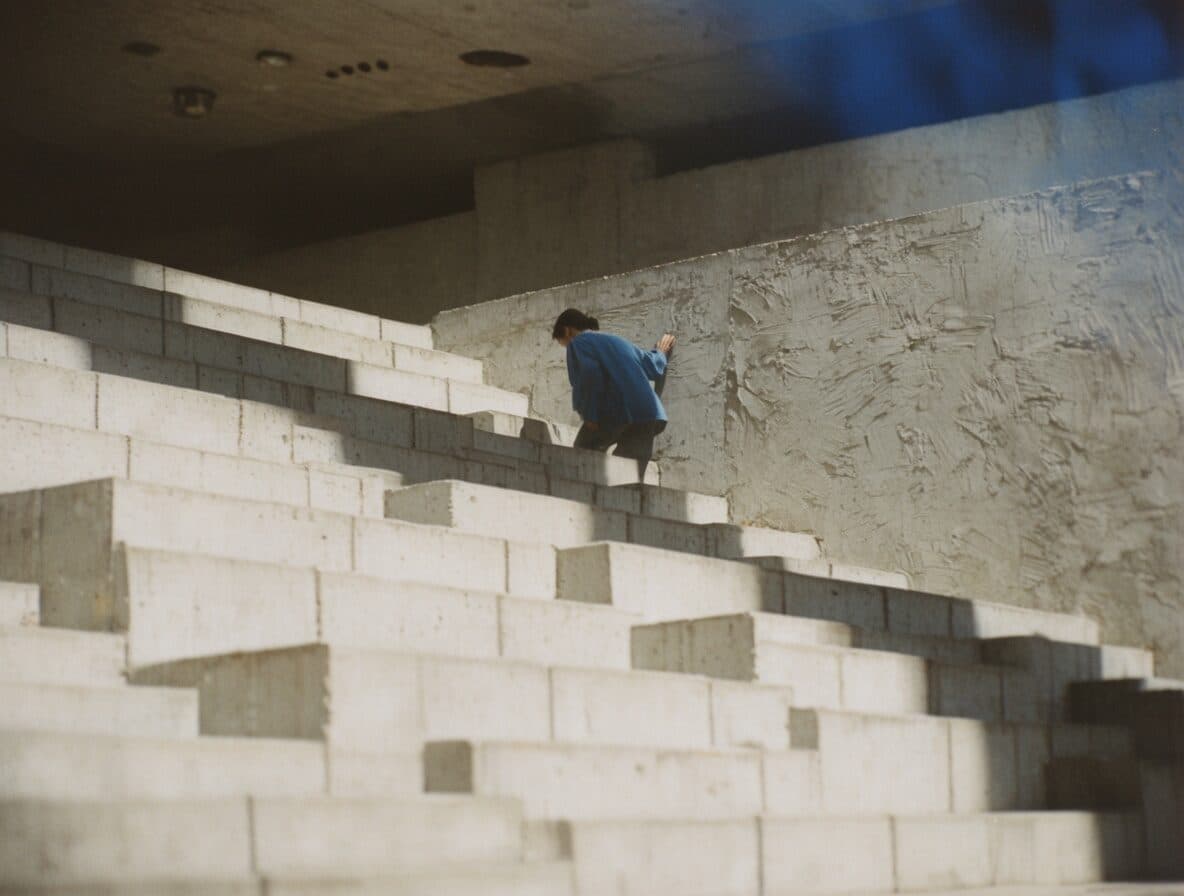 brutalist staircase with a lone figure generated with Krea 2 in Made