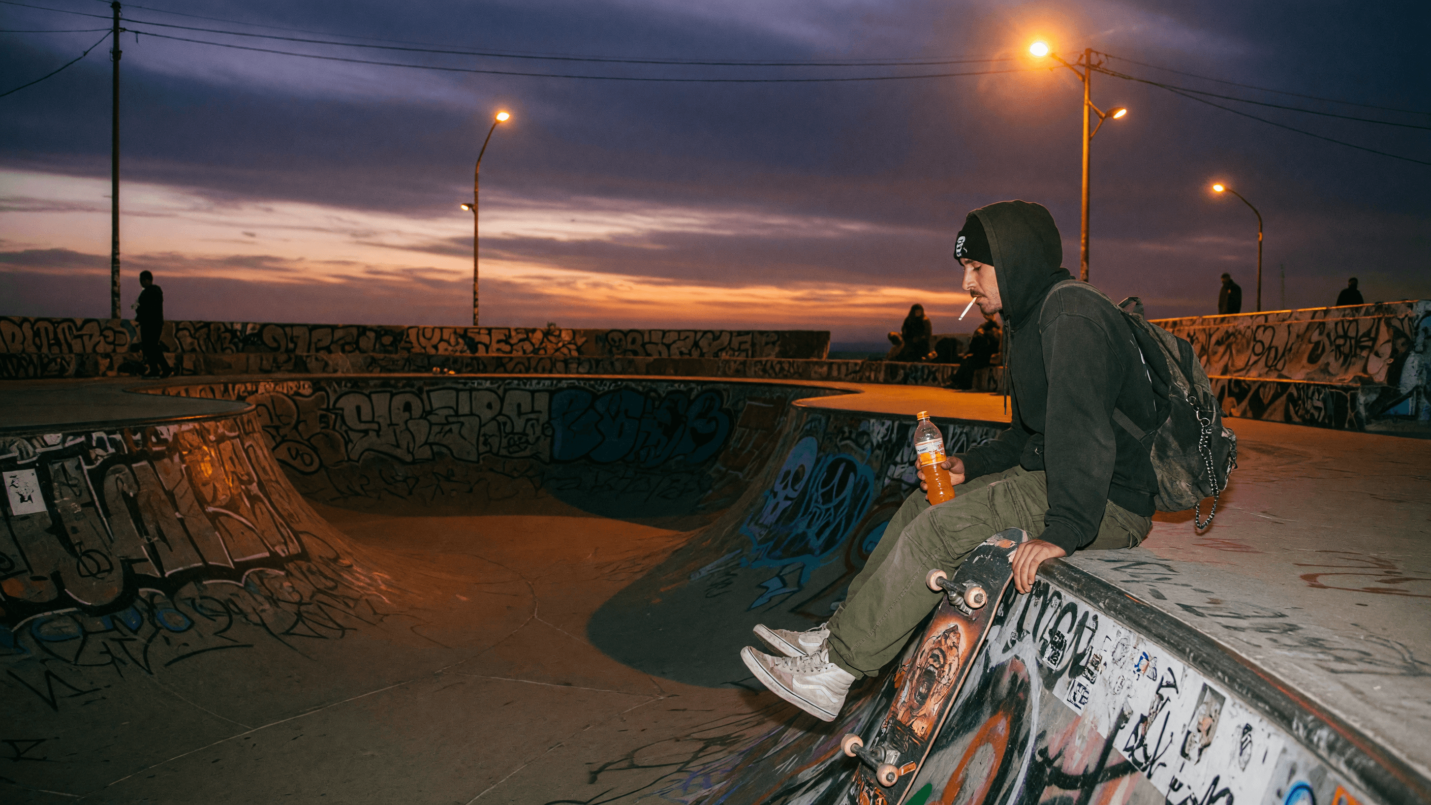 Skateboarder at a concrete bowl at dusk, a composition brief for MiniMax H3 Max