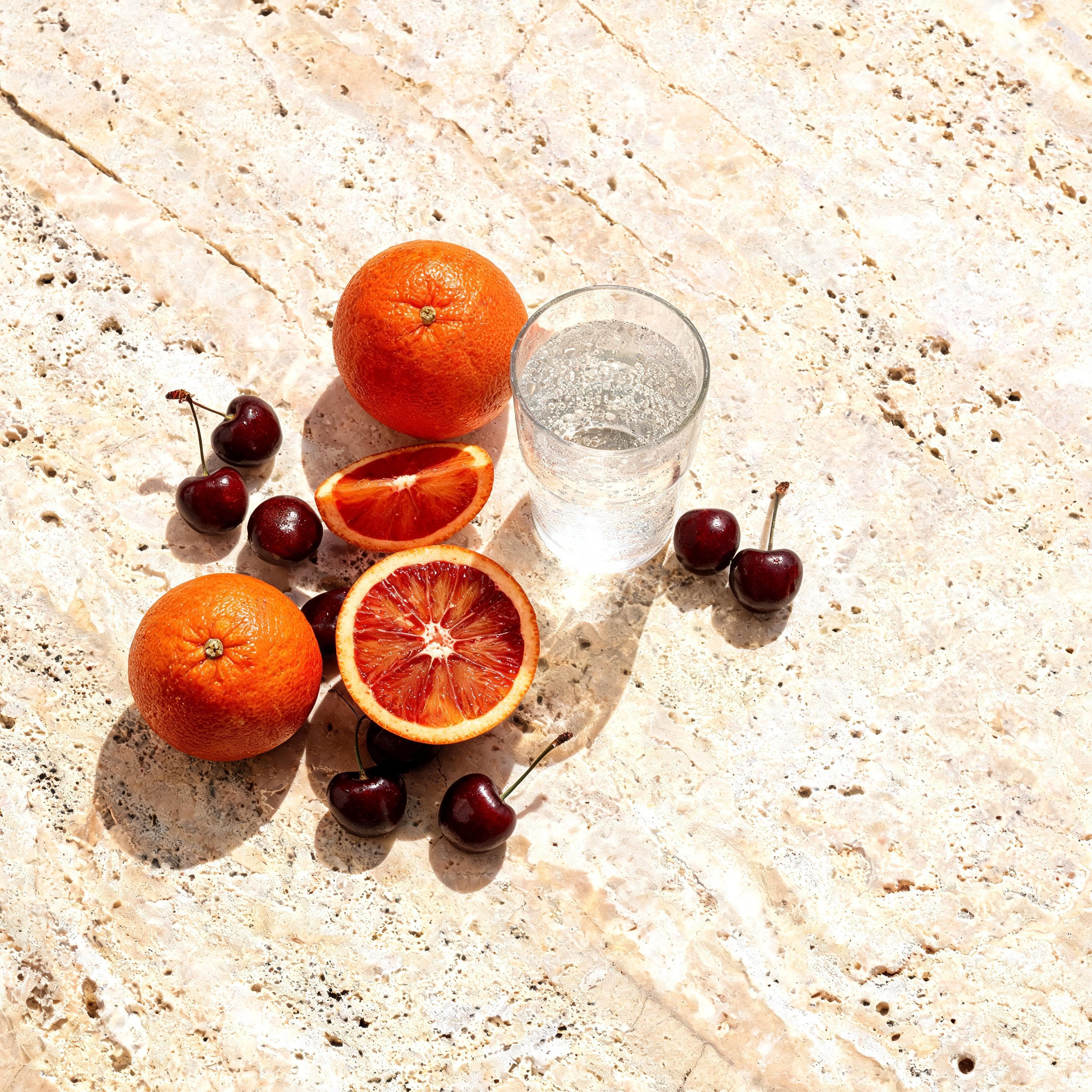 overhead blood orange and cherry still life generated with Seedream 5 Lite in Made