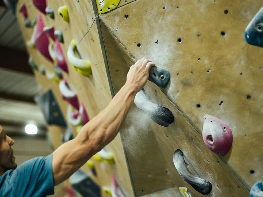 climber on an indoor bouldering wall generated with Z Image in Made