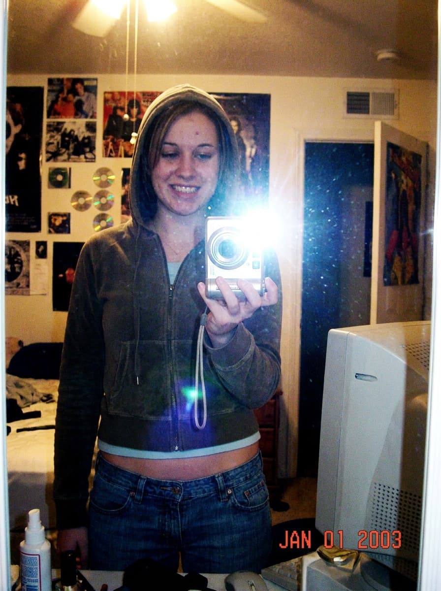 Mirror selfie with early-2000s compact camera styling